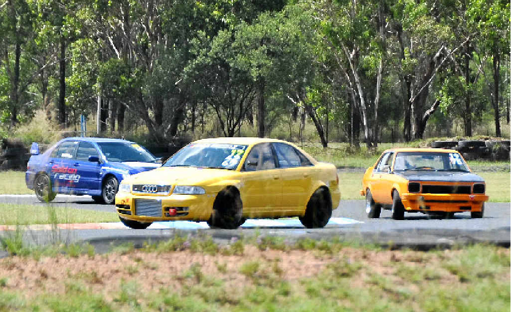 Cars battle it out at the first turn of Morgan Park during the Short Circuit Motorsport Association meeting. Cars battle it out at the first turn of Morgan Park during the Short Circuit Motorsport Association meeting.